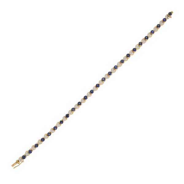 Bracciale tennis cuori in oro a due colori 18kt