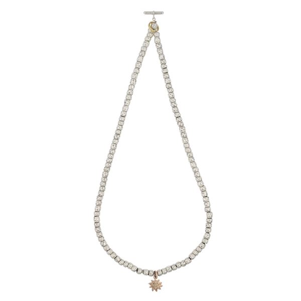 Dodo Pomellato Pepite necklace with a sun pendant