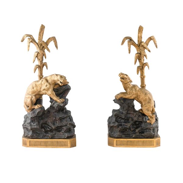 Coppia di alari in bronzo dorato e brunito