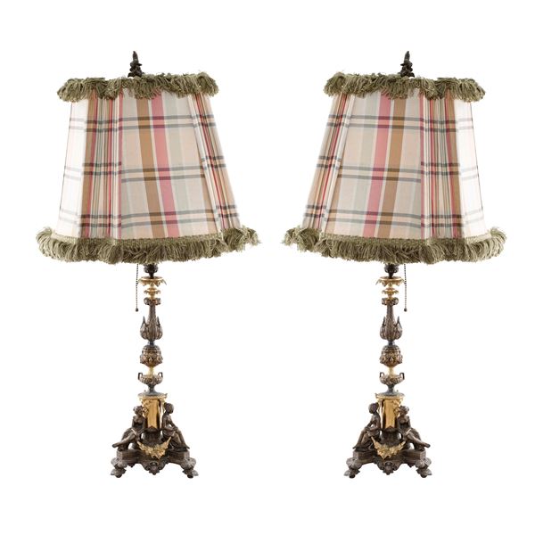 Pair of electrified burnished and golden bronze candelabra