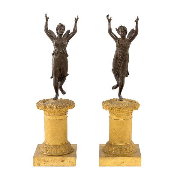 Coppia di sculture in bronzo dorato e patinato