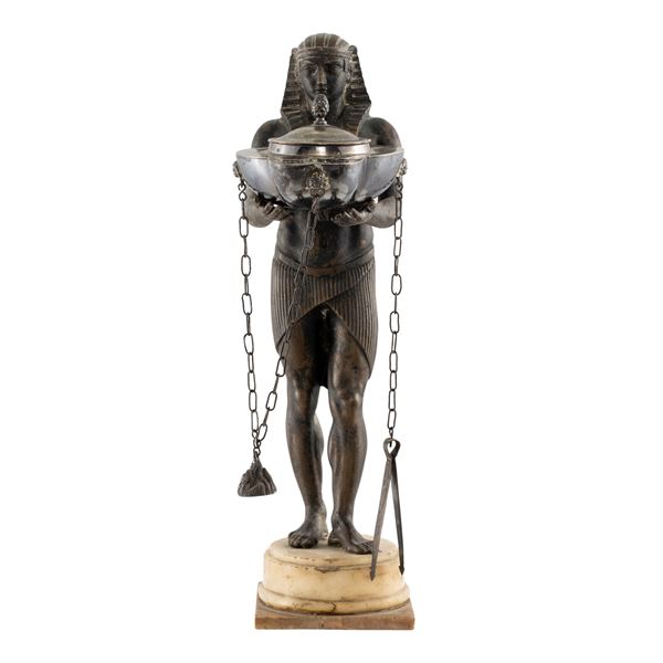 Patinated bronze and silver oil lamp on marble base