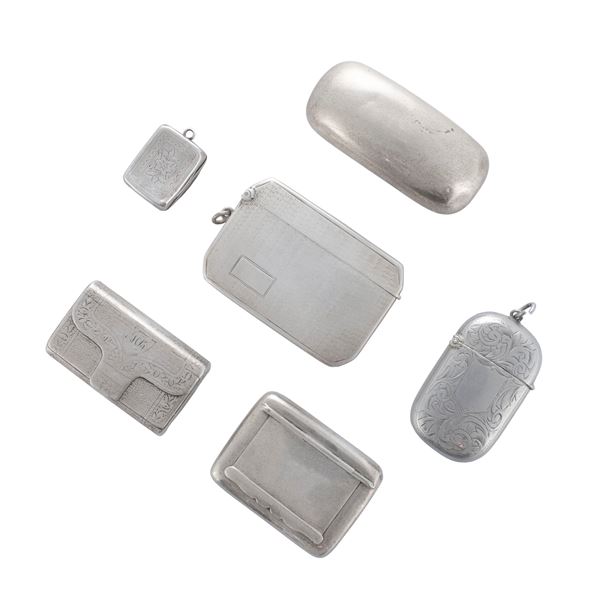 Group of six silver match holders