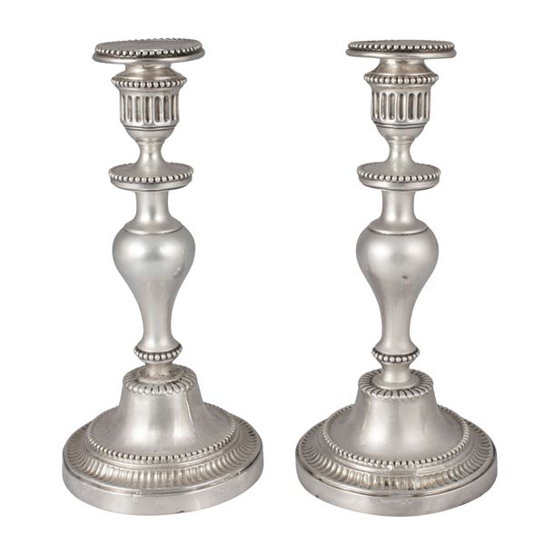Pair of silver candlesticks