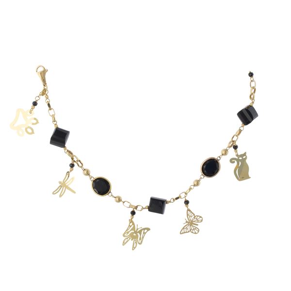 Bracciale in oro giallo 18kt e onice nero