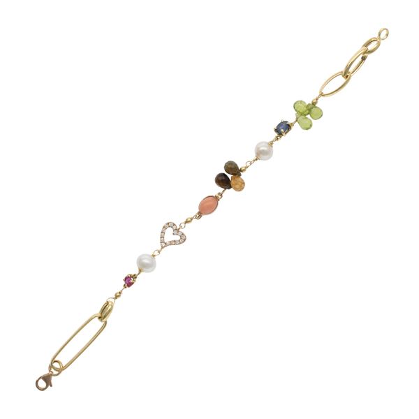 Bracciale con cuore in oro giallo 18kt e diamanti