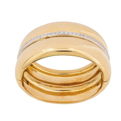 Bracciale a manetta in oro giallo e bianco con diamanti