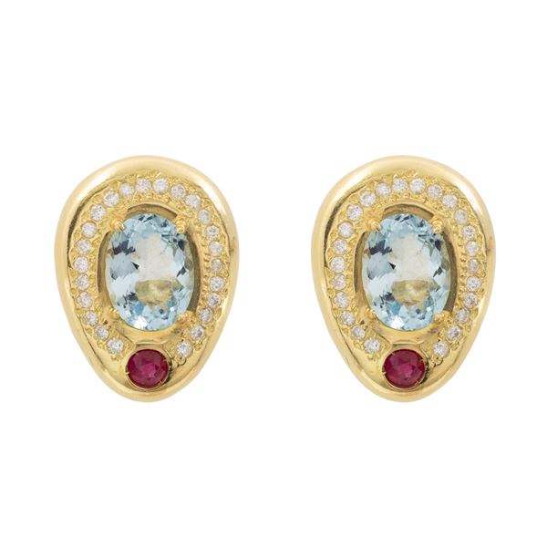 14kt yellow gold lobe earrings with blue topaz