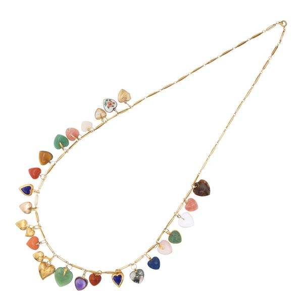 Long 18kt yellow gold necklace with twenty-six heart pendants