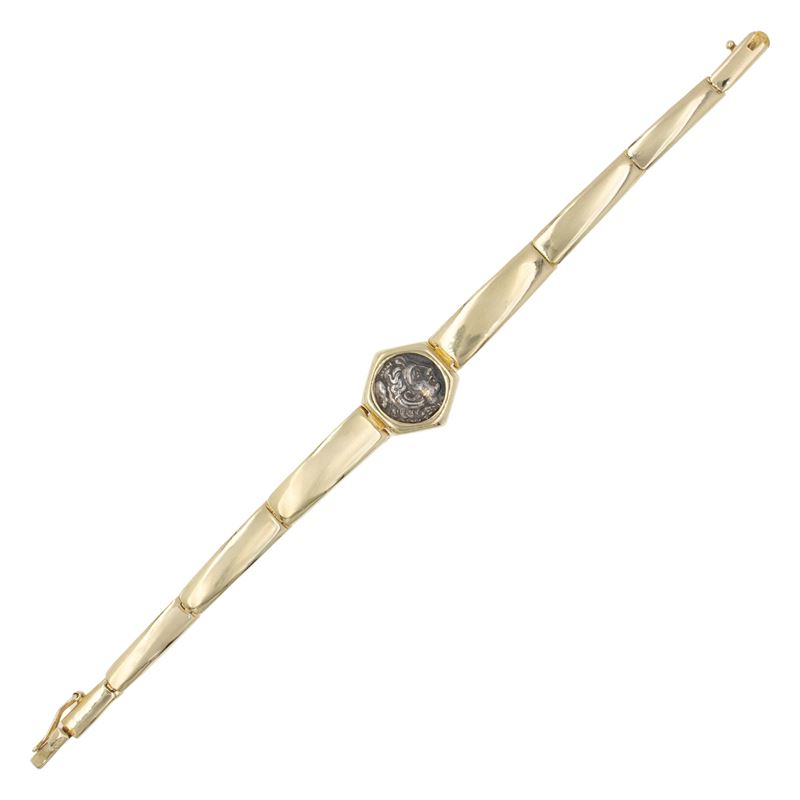 Bracciale in oro giallo 14kt con moneta