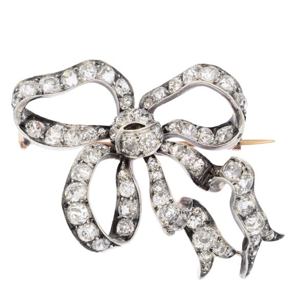 Ancient gold, silver and diamonds ribbon shaped brooch