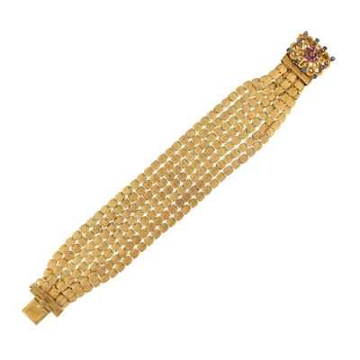 Bracciale a sette fili in oro giallo satinato 18kt con gemme
