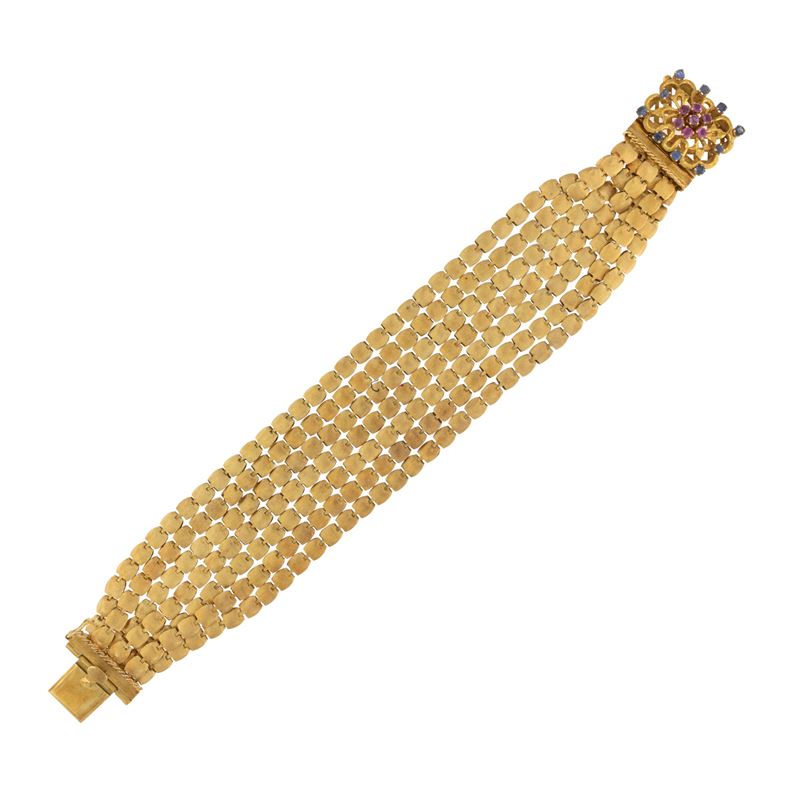 Bracciale a sette fili in oro giallo satinato 18kt con gemme