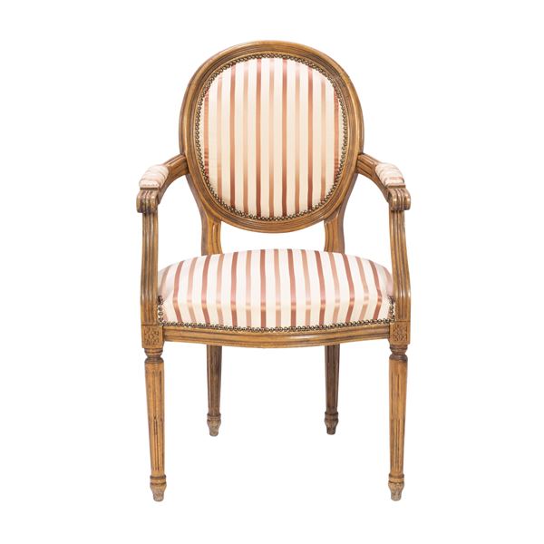 Wood and padded fabric armchair