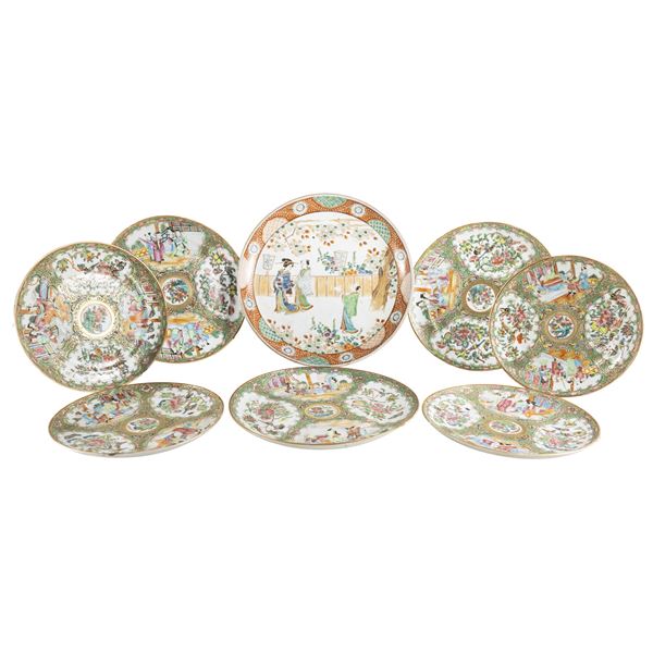 Group of eight polychrome porcelain plates