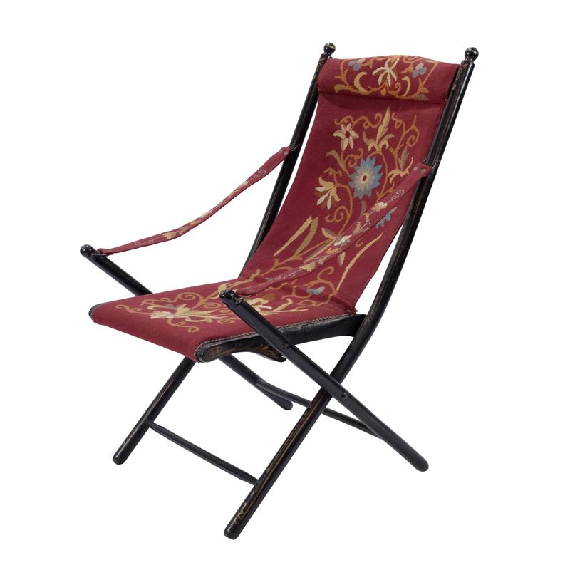 Poltrona pieghevole in legno ebanizzato e parzialmente dipinto