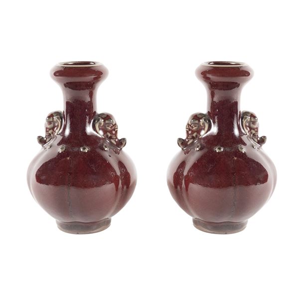 Pair of oxblood monochrome glazed ceramic vases