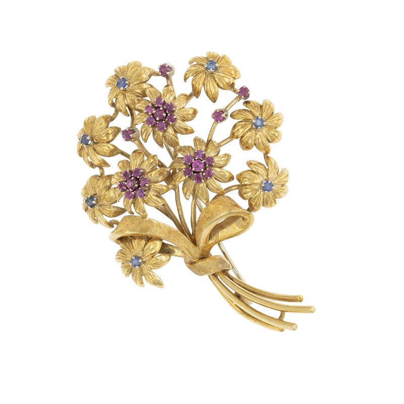 Spilla a motivo floreale in oro giallo 18kt