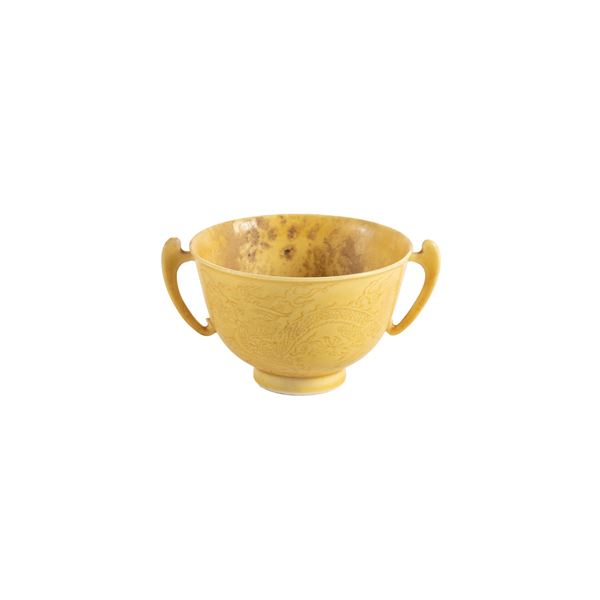 Small yellow porcelain cup with two handles