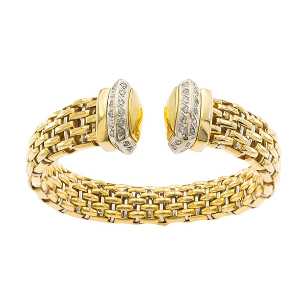 Bracciale a manetta in oro a due colori 18kt