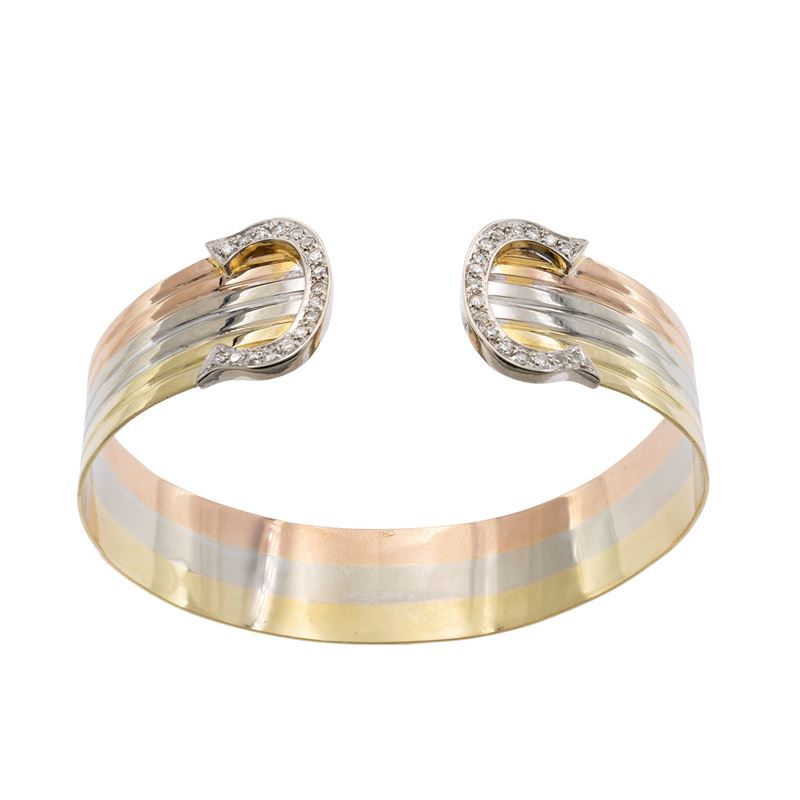 Bracciale a manetta in oro a tre colori 18kt