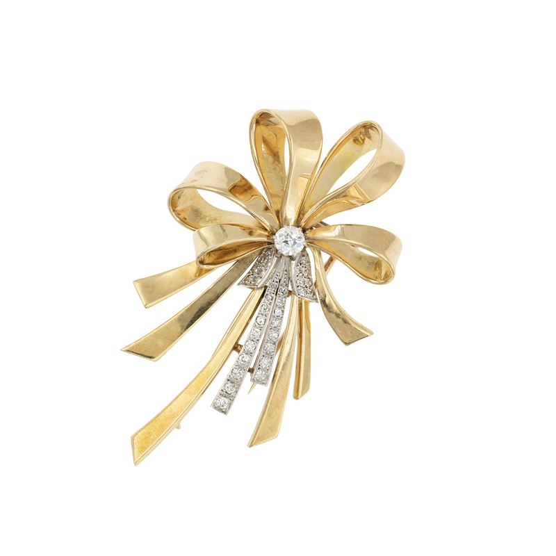 Spilla fiocco in oro giallo e bianco 18kt e diamanti