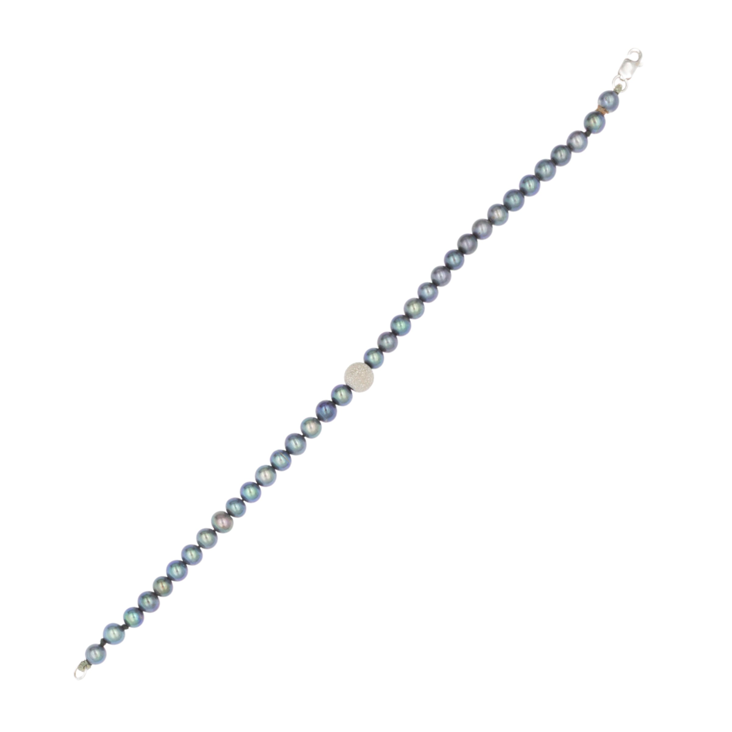 Parure composta da collana, bracciale e orecchini a lobo