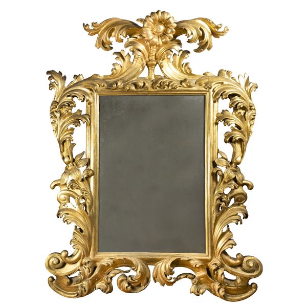 Carved and gilded wooden mirror