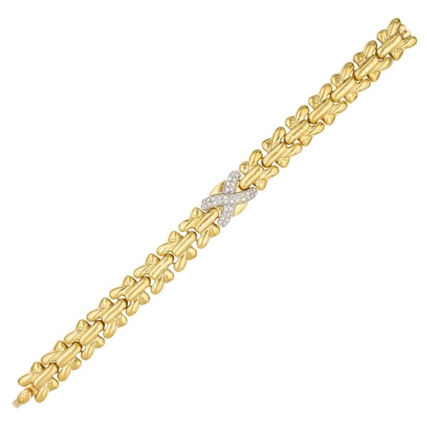 Bracciale  a motivo geometrico in oro giallo 18kt e diamanti