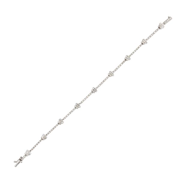 Bracciale tennis alternato da fiori in oro bianco 18kt e diamanti