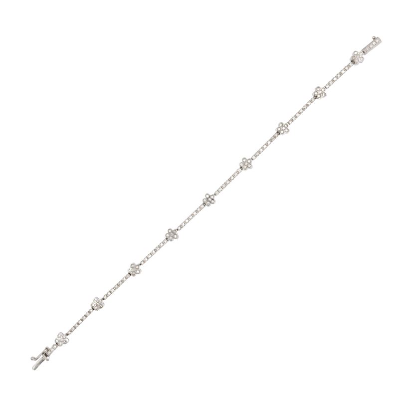Bracciale tennis alternato da fiori in oro bianco 18kt e diamanti