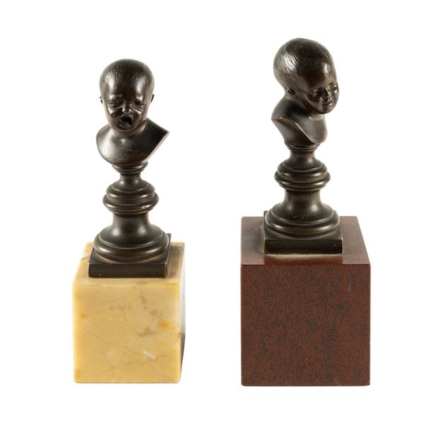Pair of small patinated bronze busts