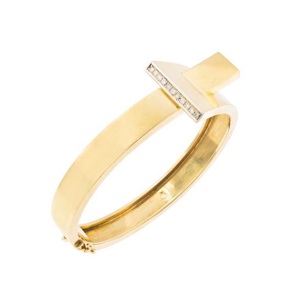 Bracciale a manetta in oro giallo 18kt e diamanti