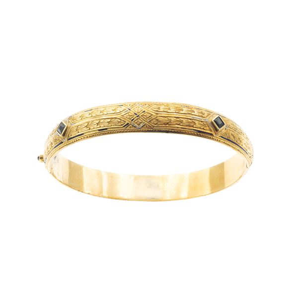 Antico bracciale a manetta in oro giallo 18kt sbalzato ed inciso