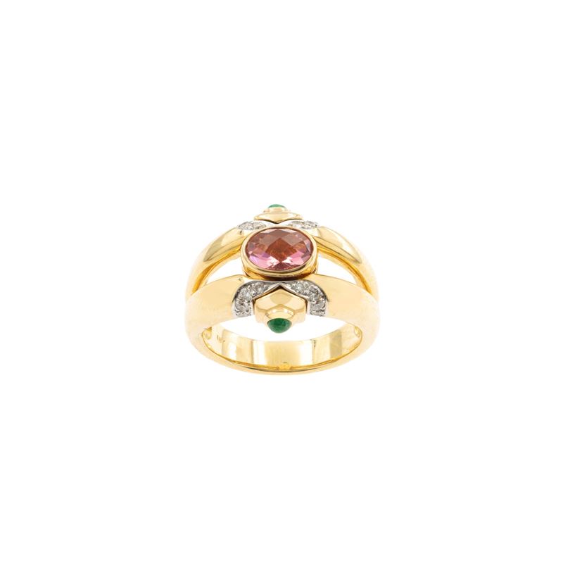 Anello a ponte in oro giallo 18kt con tormalina rosa removibile, diamanti e smeraldi