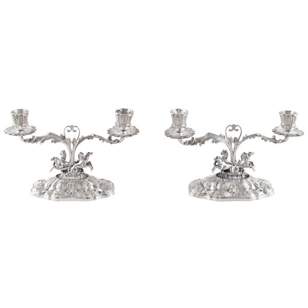 Pair of silver double candlesticks