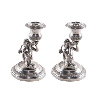 Coppia di piccoli candelieri in argento, stelo a foggia di Tritone su base circolare, Roma, XIX s...
