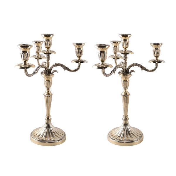 Pair of four-flame vermeil candelabra