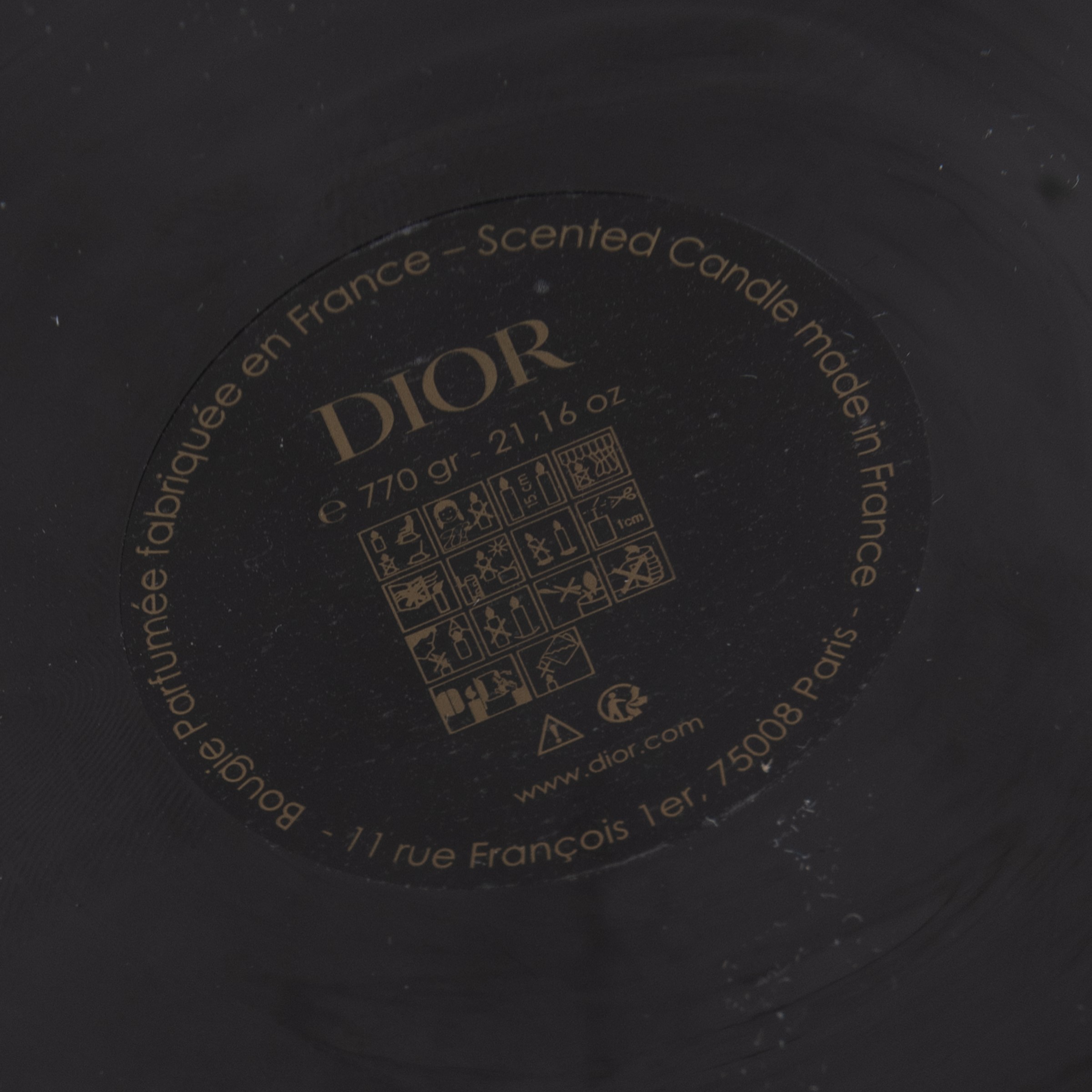 Dior, candela profumata in vaso di vetro colorato