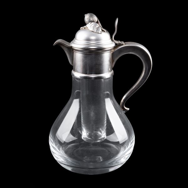 Transparent glass and silver carafe