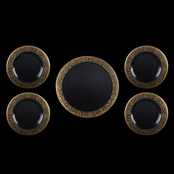 Five transparent and golden cut glass trays