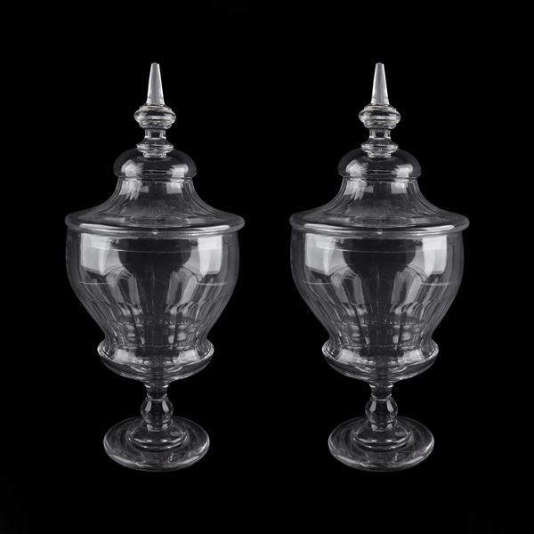 Pair of blown and transparent glass potiches