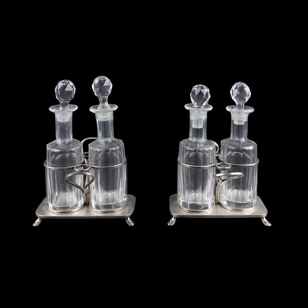 Pair of silvered metal oil cruets
