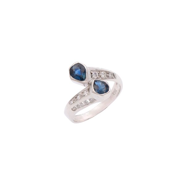 18kt white gold with sapphires and diamonds contrarié ring