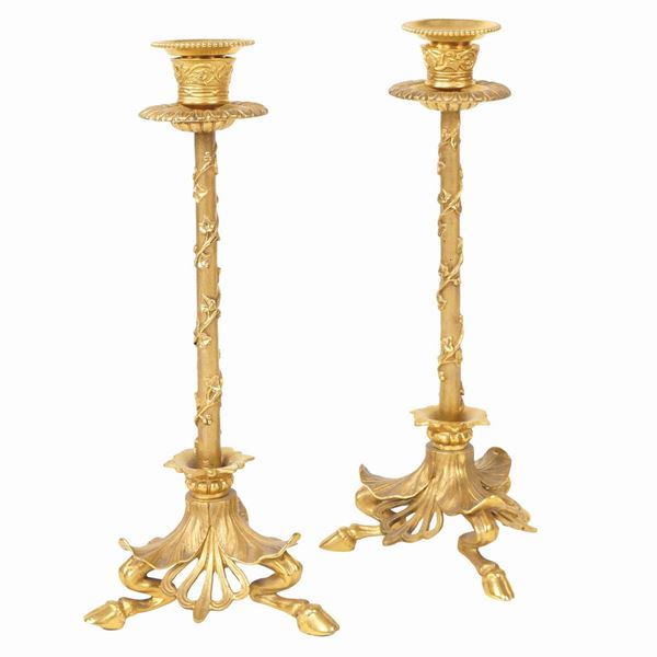 A pair of French ormolu candlesticks