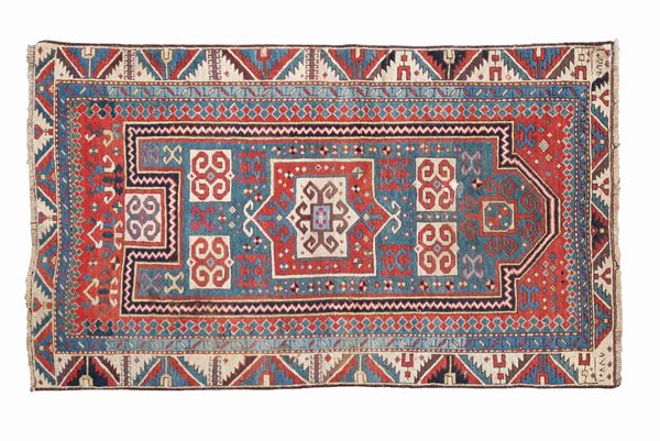 An antique Caucasian carpet